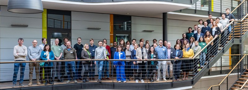 Group photo of the CERTAINTY consortium on a staircase at ICCAS
